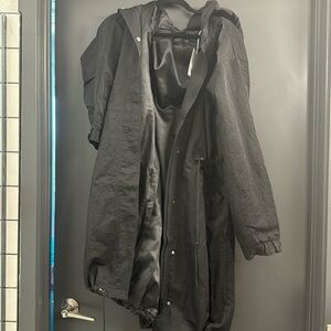 Black Trench coat with adjustable drawstrings and detachable hood.